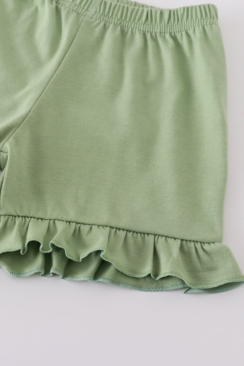 Green garden rose set: vibrant floral top and shorts for playful summer days.