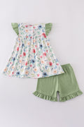 Green garden rose set: vibrant floral top and shorts for playful summer days.