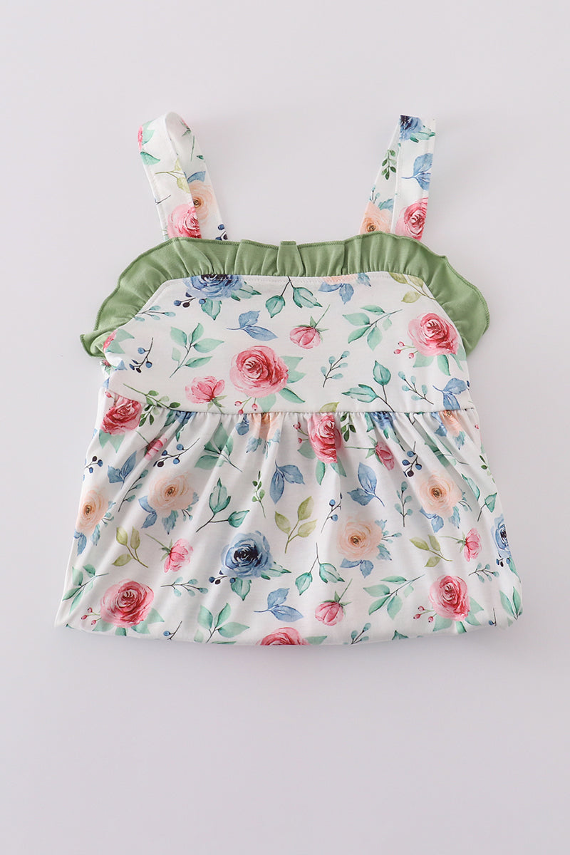 Green garden rose dress with vibrant floral pattern, perfect for playful summer days.