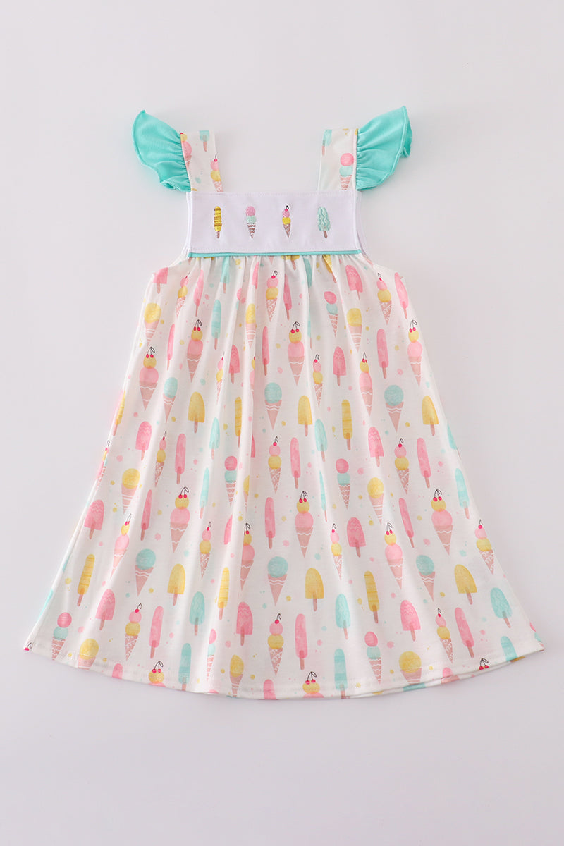 A charming mint dress with ice cream embroidery, perfect for summer fun.