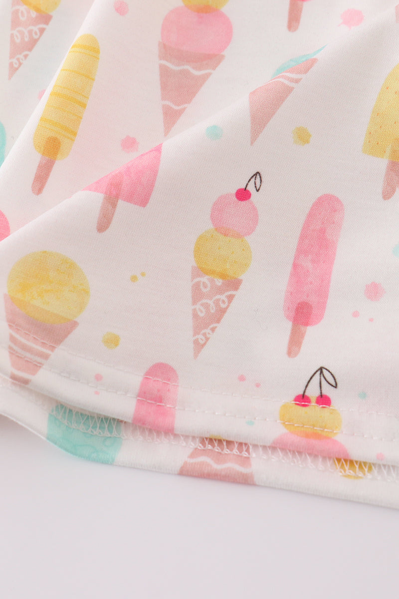 A charming mint dress with ice cream embroidery, perfect for summer fun.