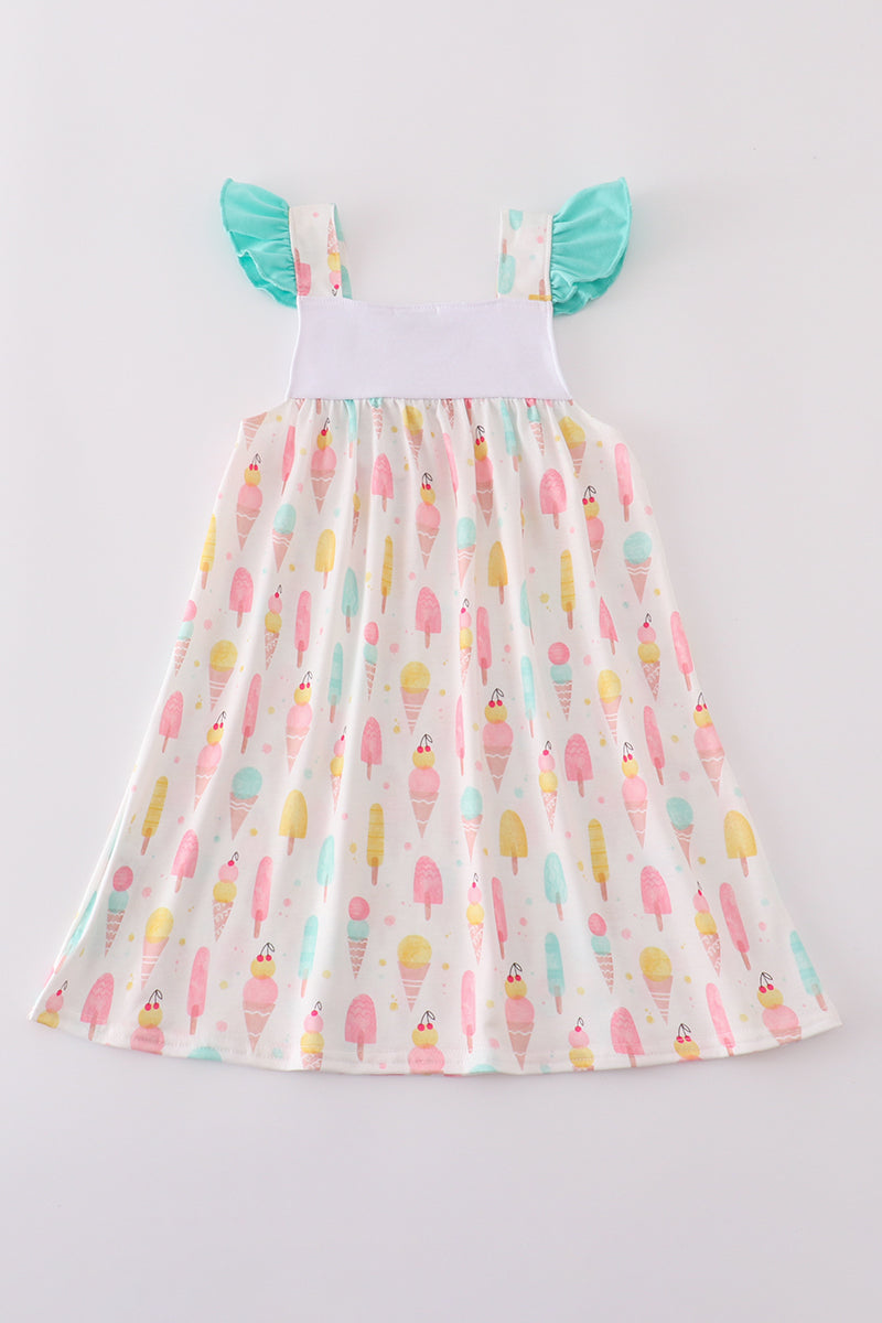 A charming mint dress with ice cream embroidery, perfect for summer fun.