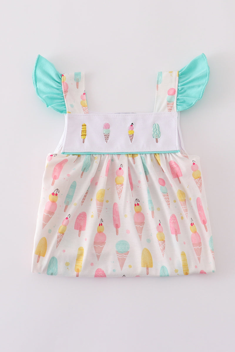 A charming mint dress with ice cream embroidery, perfect for summer fun.