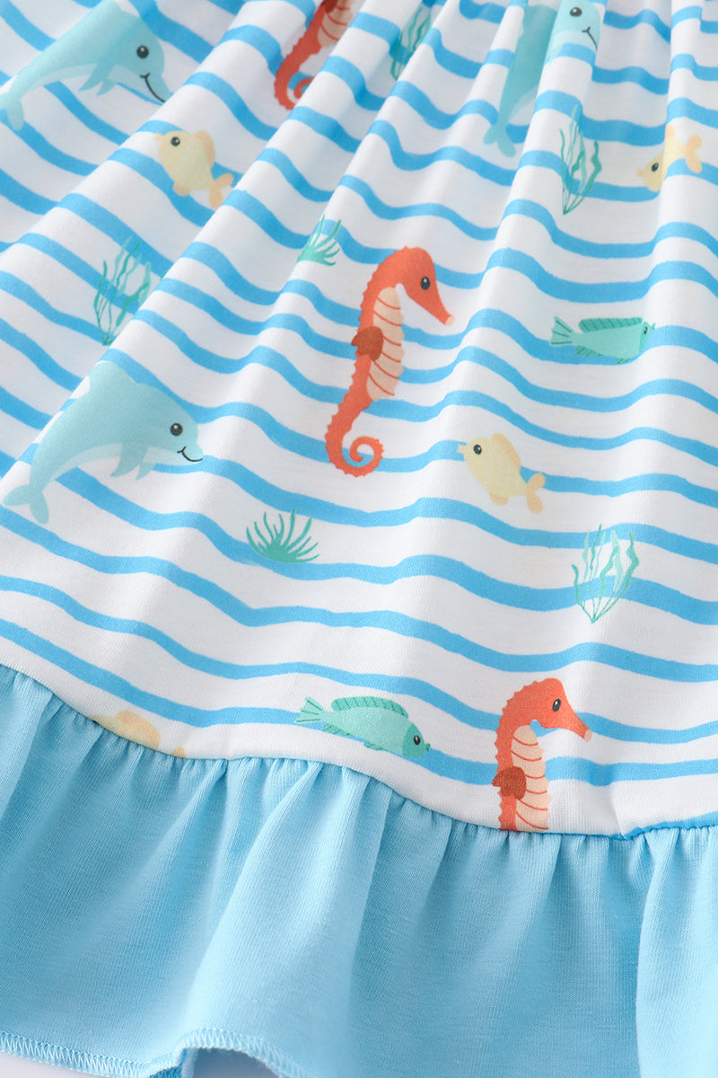 Children’s blue outfit with embroidered sea creatures, perfect for playtime adventures.