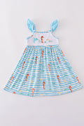 Blue dress with playful marine creature embroidery, perfect for seaside adventures.