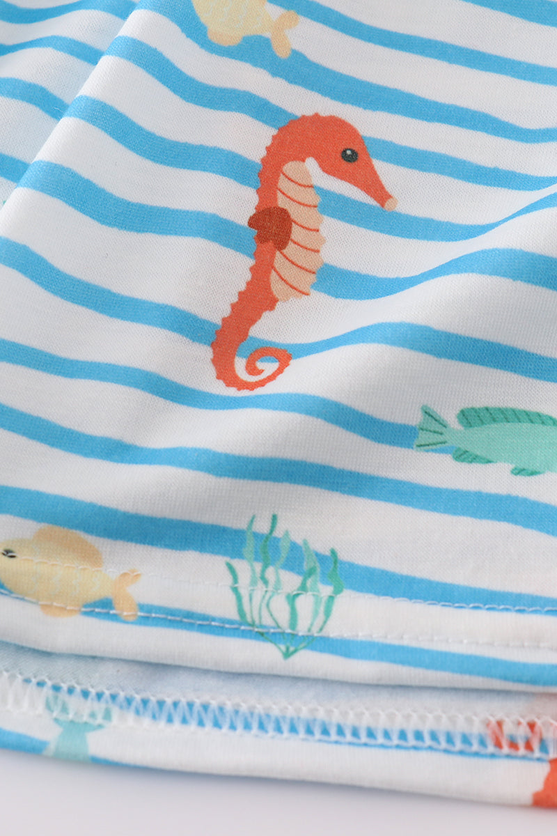 Blue dress with playful marine creature embroidery, perfect for seaside adventures.
