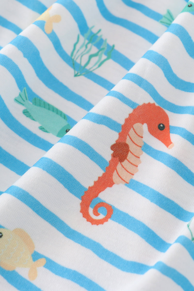 Blue dress with playful marine creature embroidery, perfect for seaside adventures.
