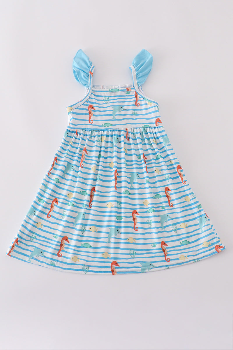 Blue dress with playful marine creature embroidery, perfect for seaside adventures.