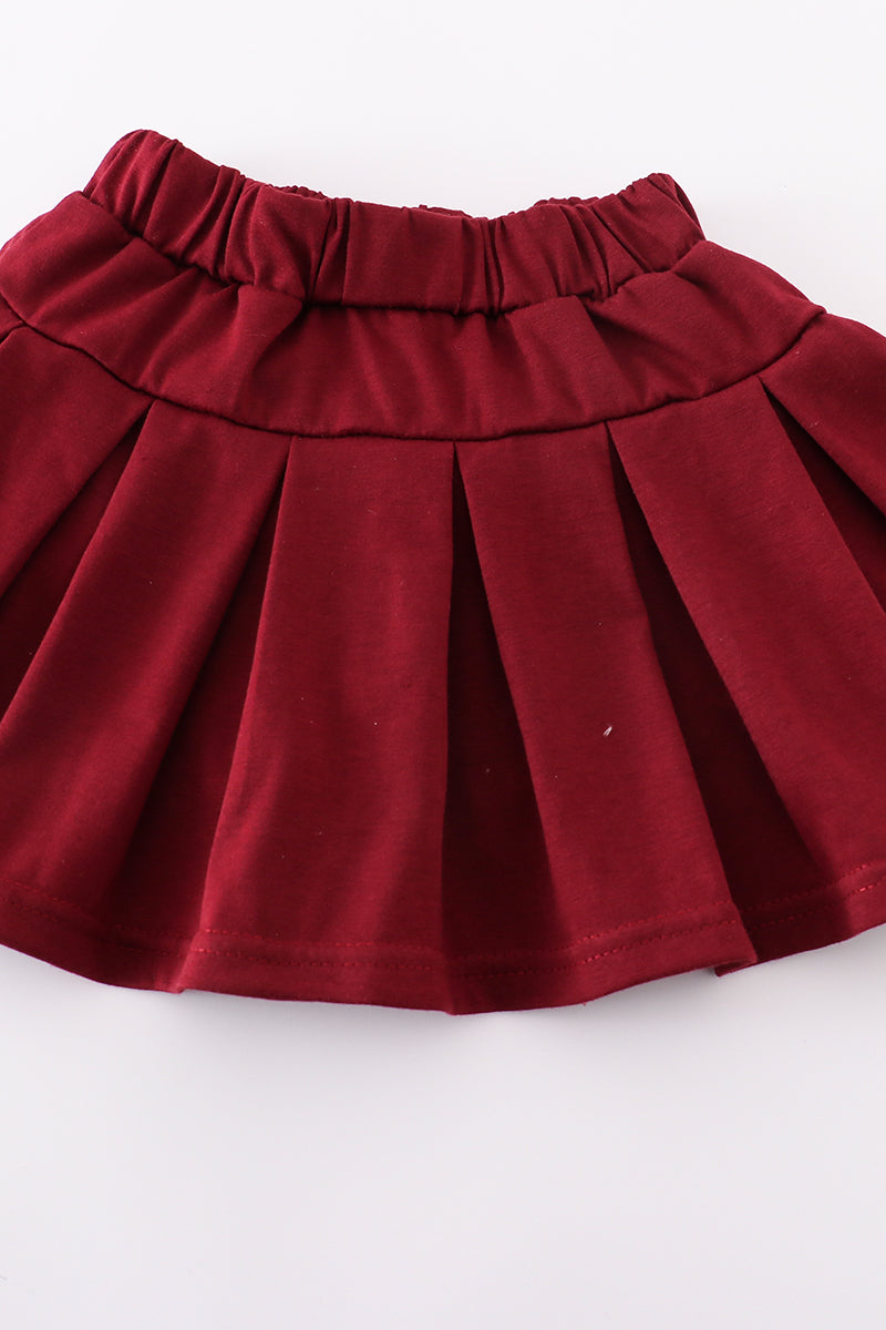 Maroon tennis set with "Mississippi" embroidery, perfect for playful adventures.