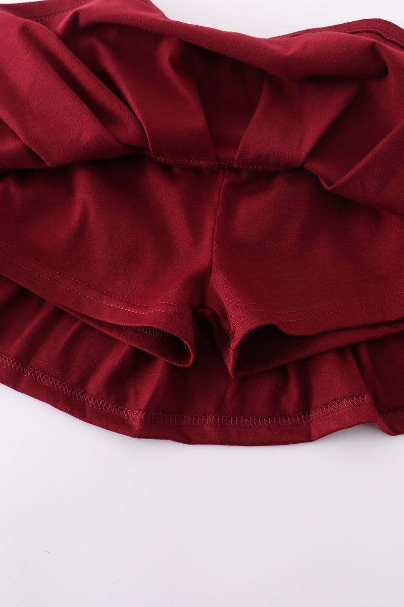 Maroon tennis set with "Mississippi" embroidery, perfect for playful adventures.