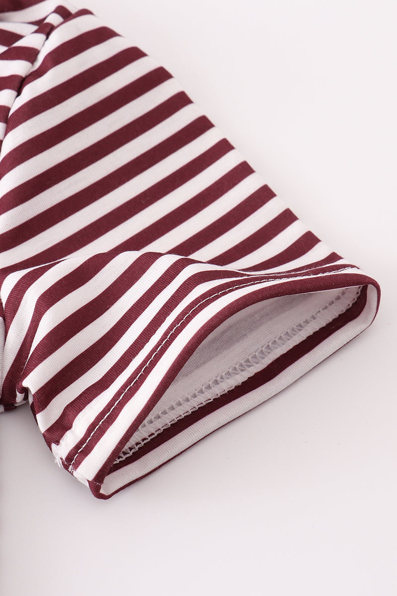 Maroon button-down shirt with Mississippi embroidery, perfect for playful adventures.