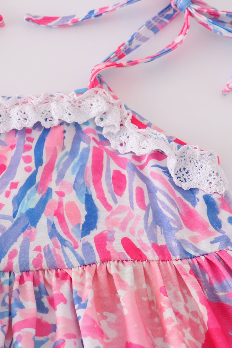 Tropical Sunset Waves set: vibrant beach-themed shirt and shorts with colorful wave patterns.