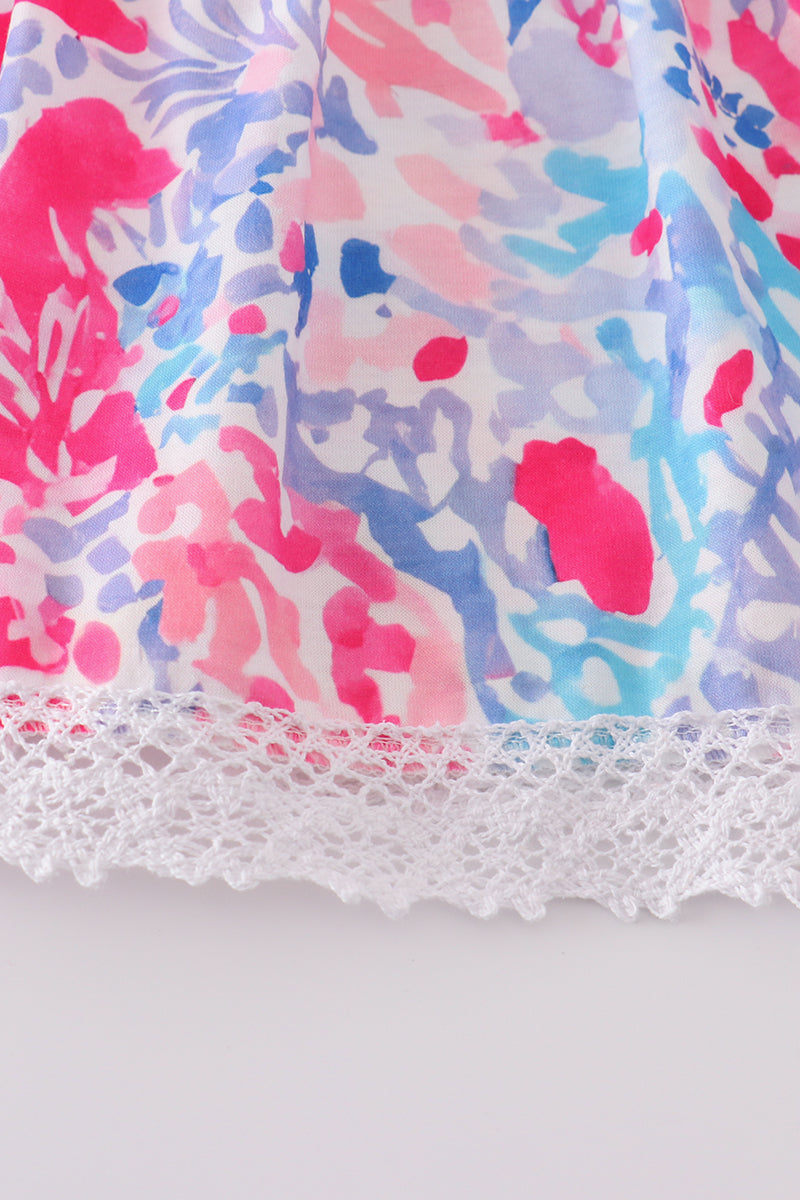 Tropical Sunset Waves set: vibrant beach-themed shirt and shorts with colorful wave patterns.