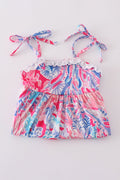 Tropical Sunset Waves set: vibrant beach-themed shirt and shorts with colorful wave patterns.