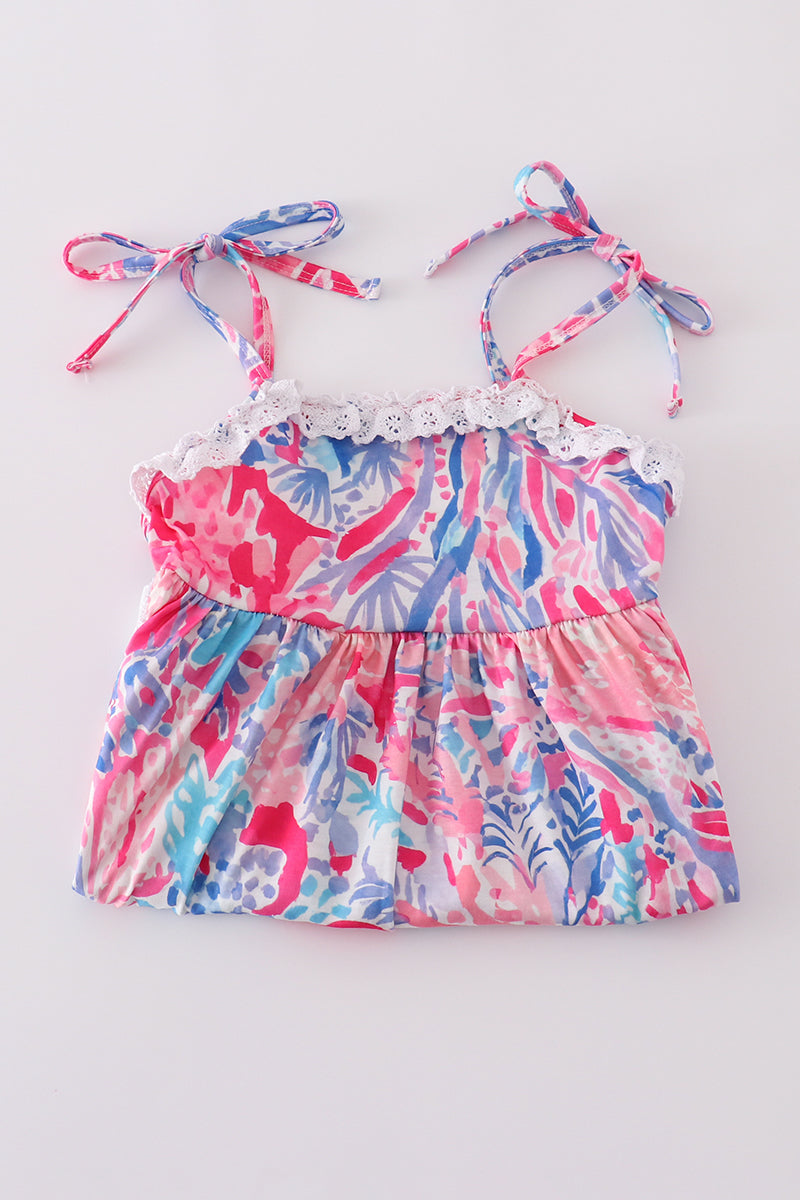 Tropical Sunset Waves set: vibrant beach-themed shirt and shorts with colorful wave patterns.