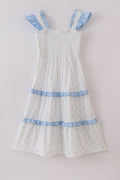 Blue tiered dress with classic lattice pattern, perfect for special occasions.