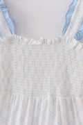 Blue tiered dress with classic lattice pattern, perfect for special occasions.