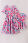 Matching Pink Paradise Reef print mom&me dresses with vibrant coral and ocean patterns.