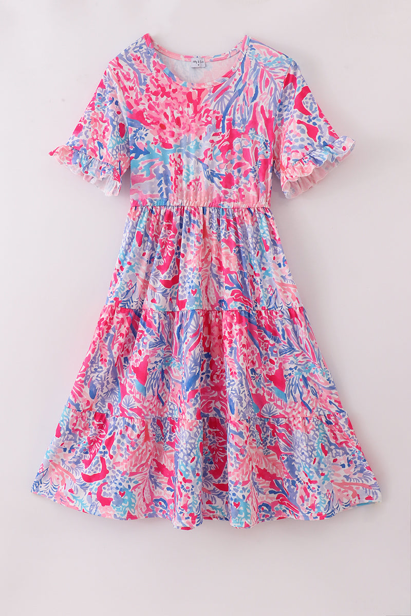 Matching Pink Paradise Reef print mom&me dresses with vibrant coral and ocean patterns.
