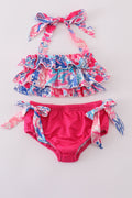 Bright pink two-piece swimsuit with reef print, perfect for beach adventures.