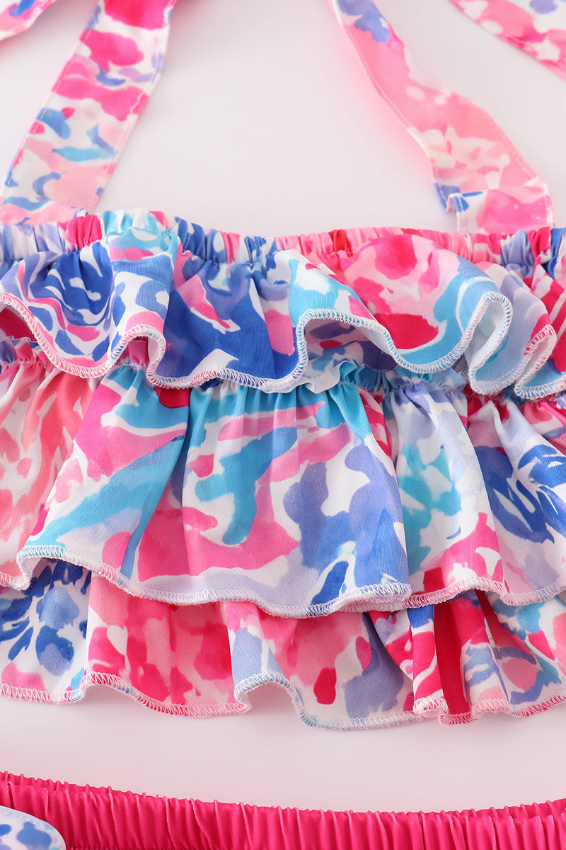Bright pink two-piece swimsuit with reef print, perfect for beach adventures.