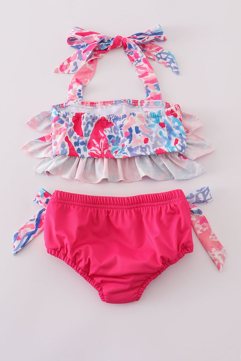 Bright pink two-piece swimsuit with reef print, perfect for beach adventures.