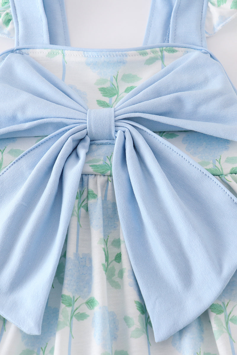 Adorable blue hydrangea print ruffle shorts set with a charming bow accent.