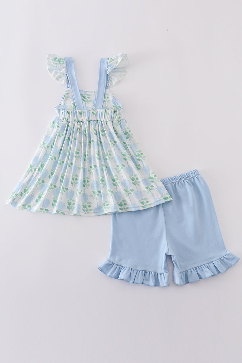 Adorable blue hydrangea print ruffle shorts set with a charming bow accent.