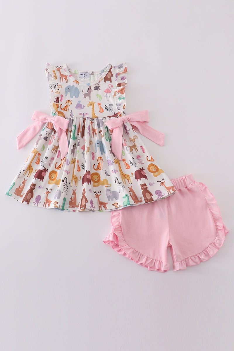 Adorable pink ruffle set with playful zoo animal print and bow accents.
