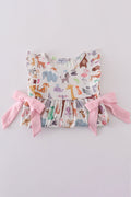 Adorable pink ruffle set with playful zoo animal print and bow accents.