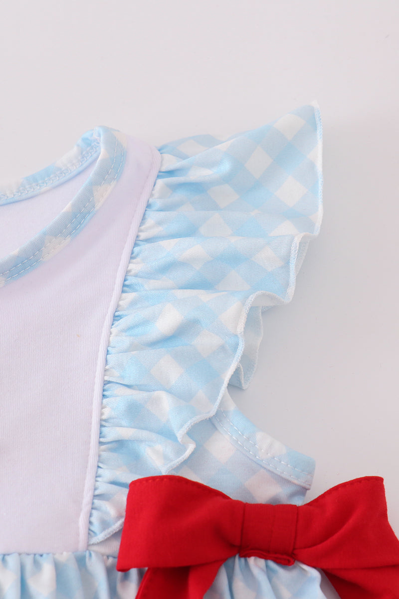 Blue gingham ruffle shorts set with flag embroidery and a matching bow.