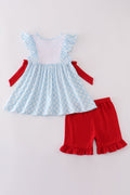 Blue gingham ruffle shorts set with flag embroidery and a matching bow.