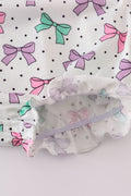 A sweet pink bubble romper with embroidered bow print, perfect for playtime.