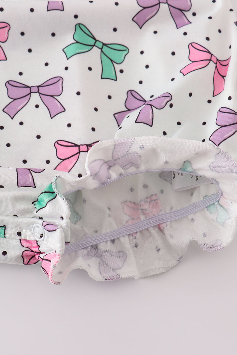 A sweet pink bubble romper with embroidered bow print, perfect for playtime.
