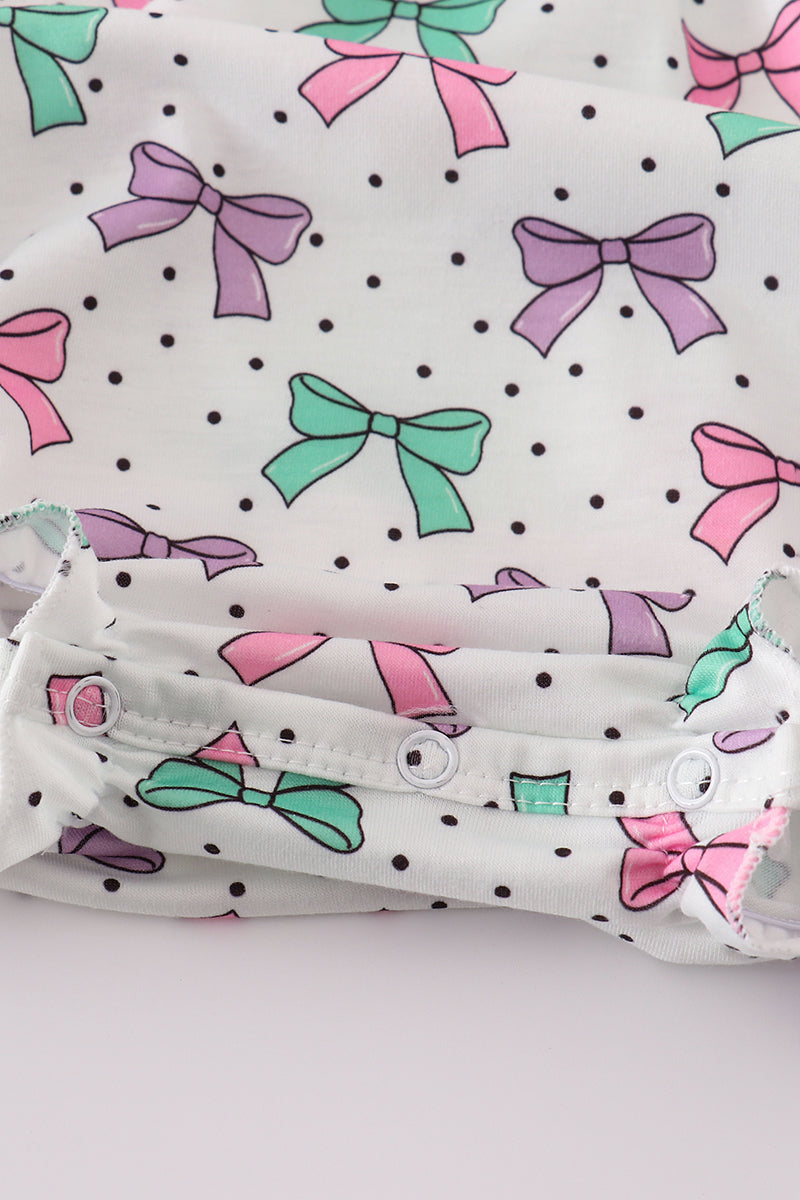 A sweet pink bubble romper with embroidered bow print, perfect for playtime.