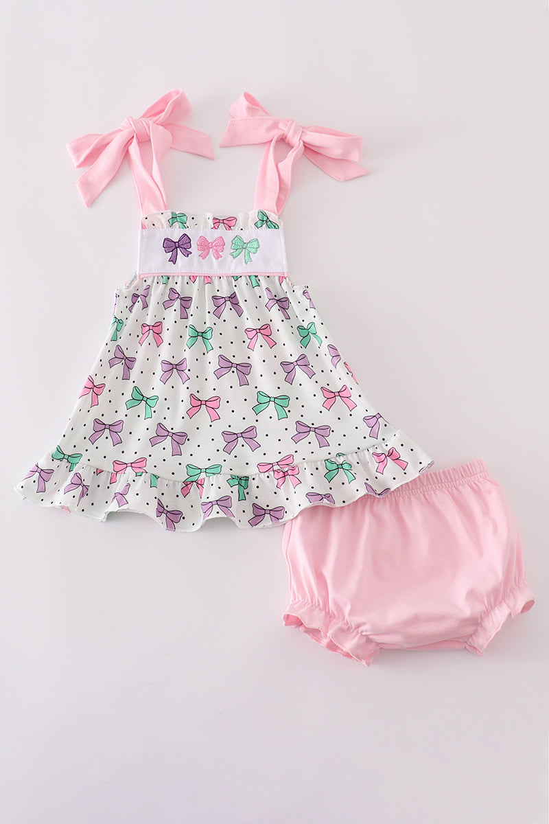 Adorable pink bloomer set with delicate bow embroidery, perfect for playful outings.