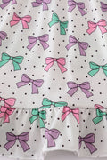 A charming pink dress with bow embroidery and playful ruffle details.