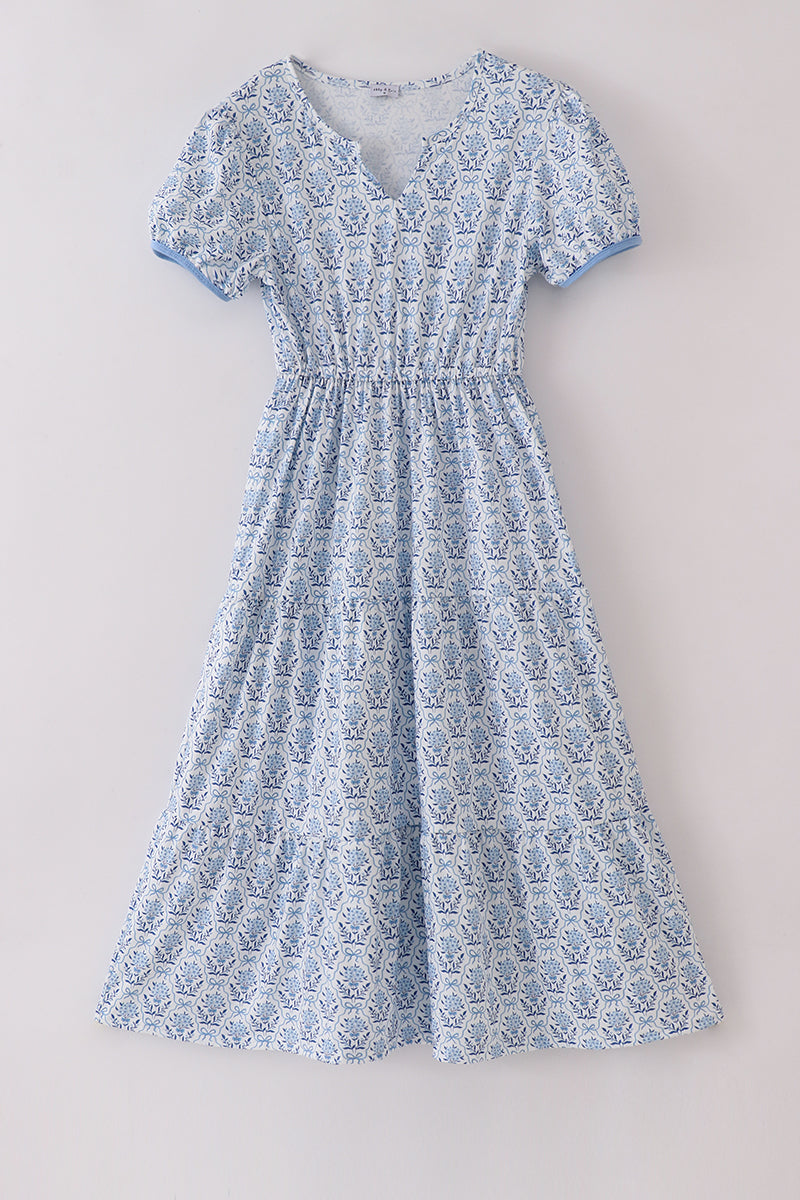 Blue toile garden bow mom tiered dress with a charming floral pattern.