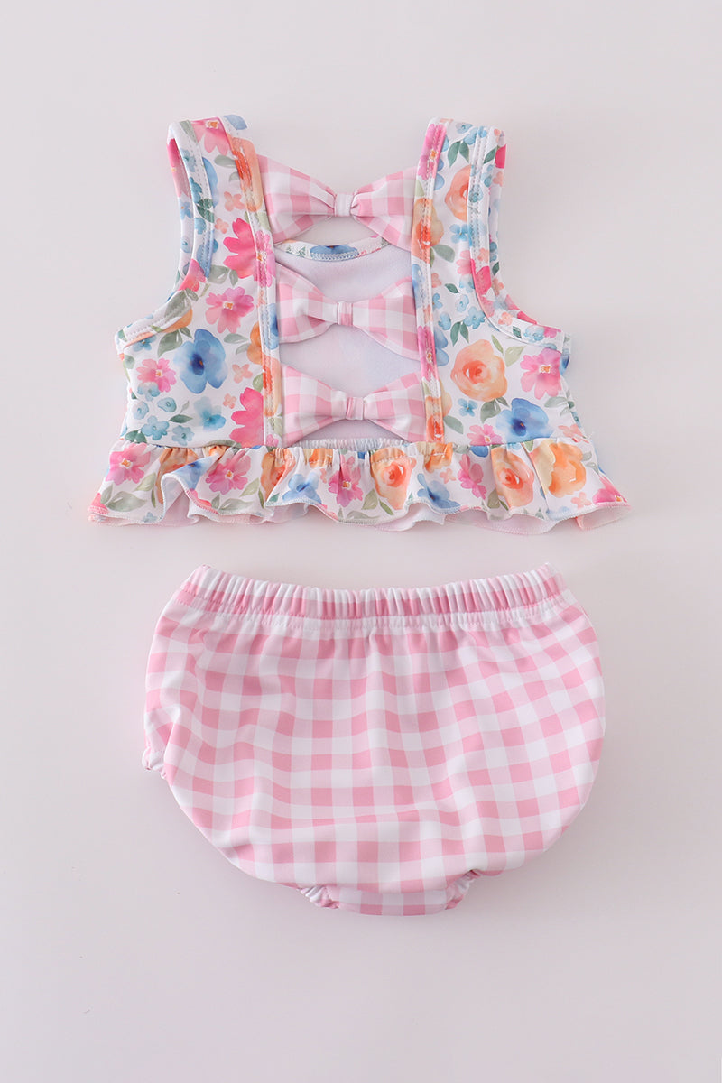 Pink watercolor floral 2-piece swimsuit with ruffled straps, perfect for sunny days.