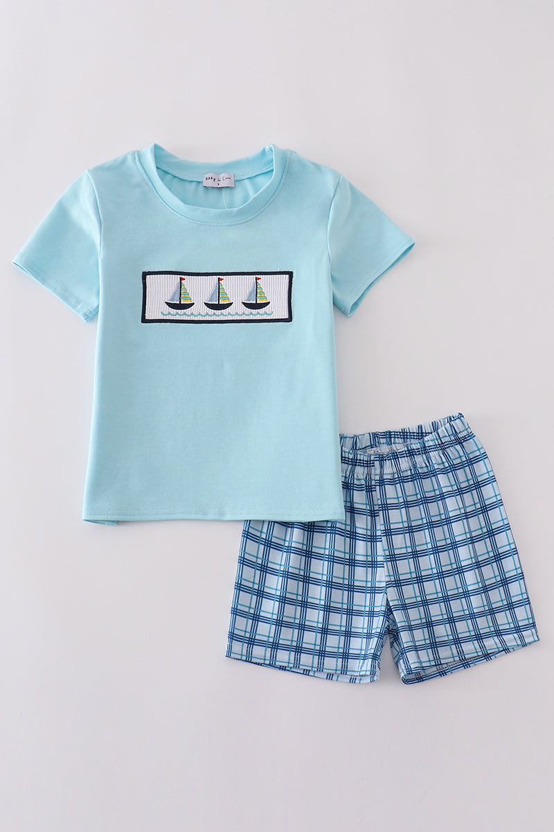 Toddler shorts set with blue sailboats embroidery and smocked detailing, perfect for summer.