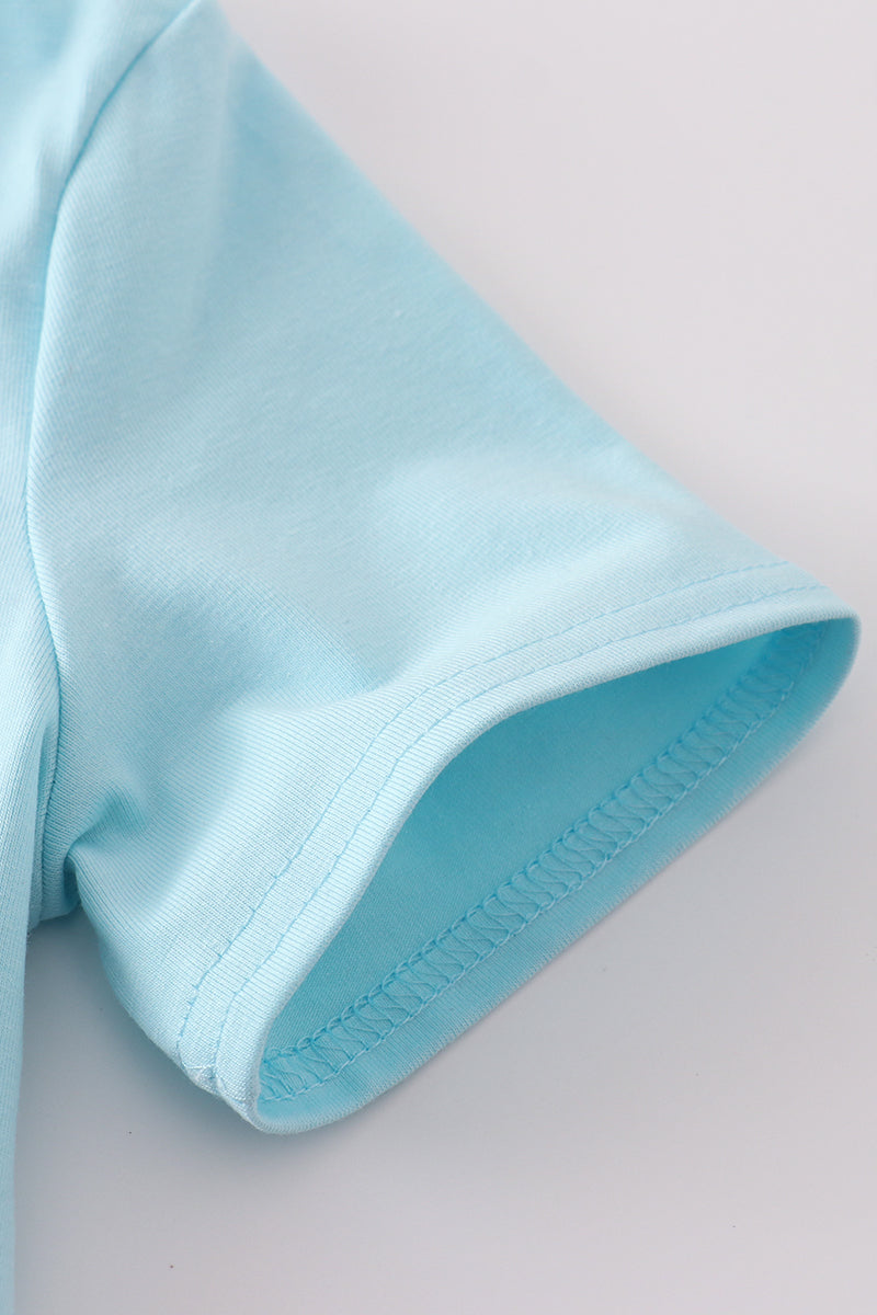 Toddler shorts set with blue sailboats embroidery and smocked detailing, perfect for summer.