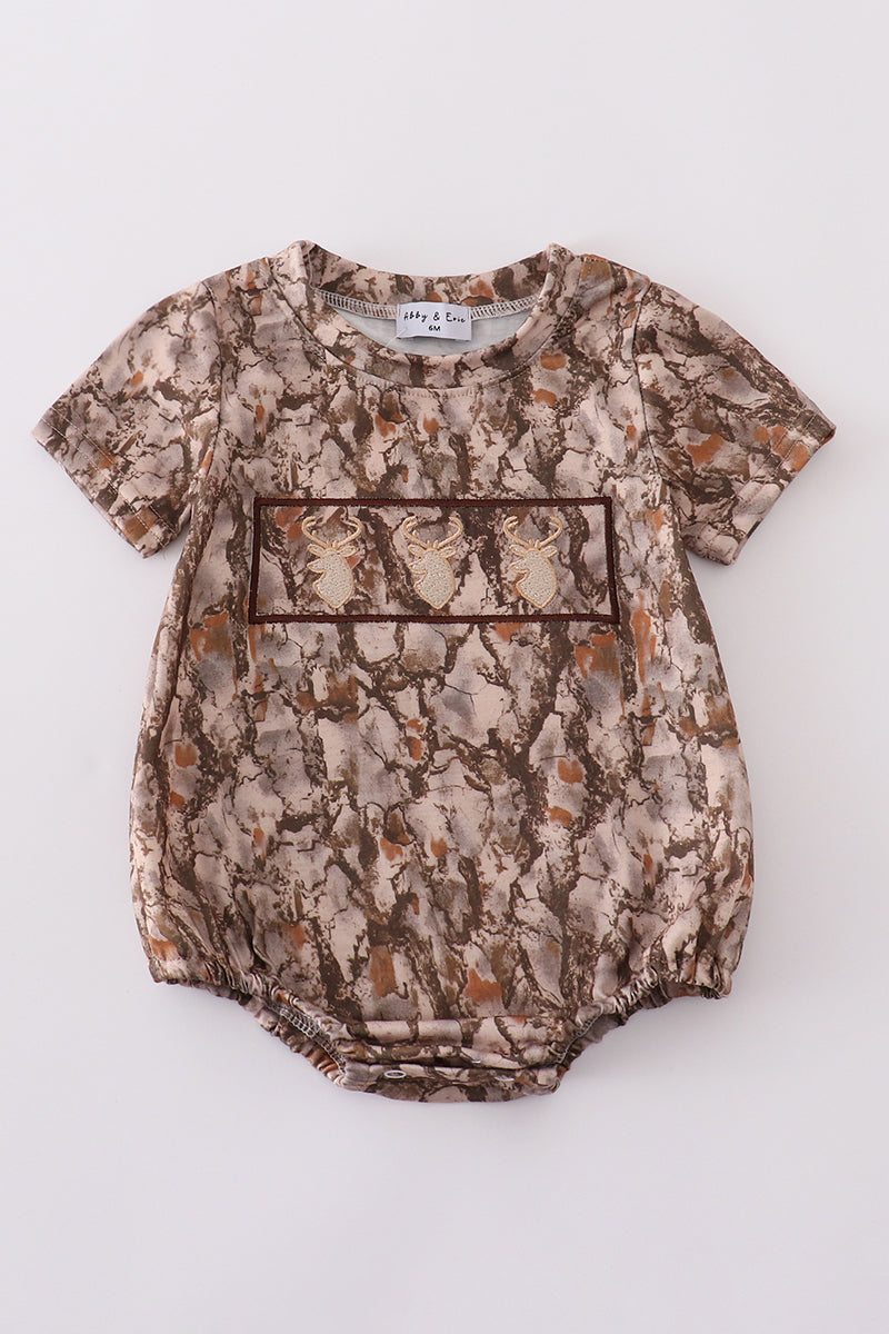 Brown bubble romper with three adorable deer embroidered on the front.