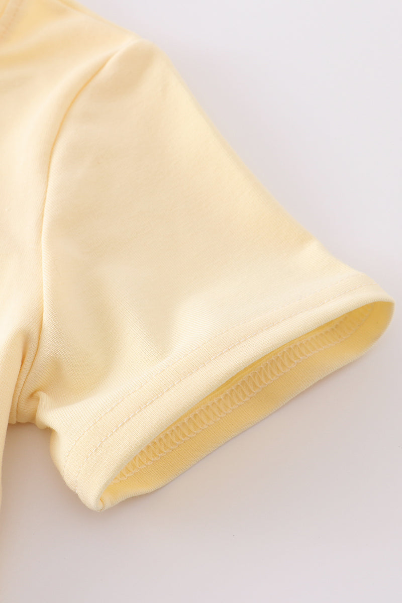 Yellow gingham shorts set with cute golf cart applique, perfect for summer fun.
