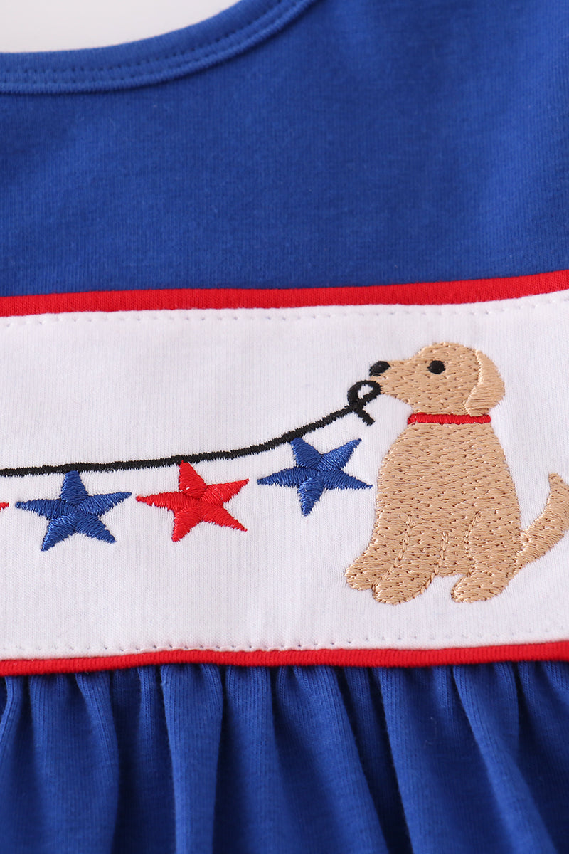 Adorable blue ruffle shorts set with puppy and star embroidery, perfect for playtime.