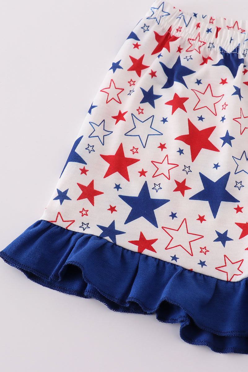 Adorable blue ruffle shorts set with puppy and star embroidery, perfect for playtime.