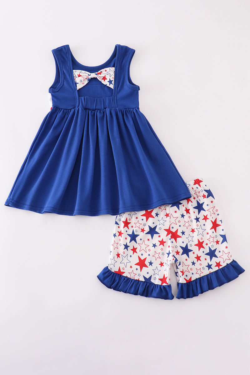 Adorable blue ruffle shorts set with puppy and star embroidery, perfect for playtime.