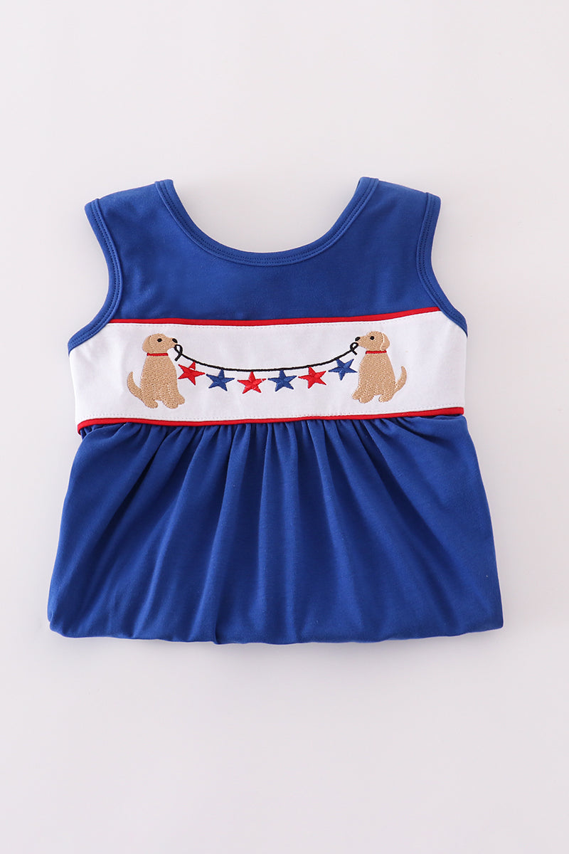 Adorable blue ruffle shorts set with puppy and star embroidery, perfect for playtime.