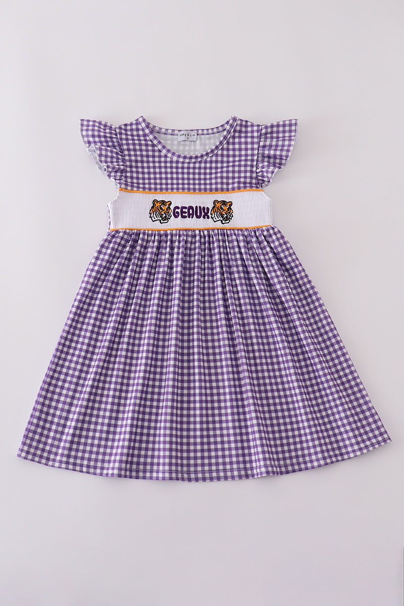 Purple smocked dress with gold LSU geaux embroidery, perfect for game day.