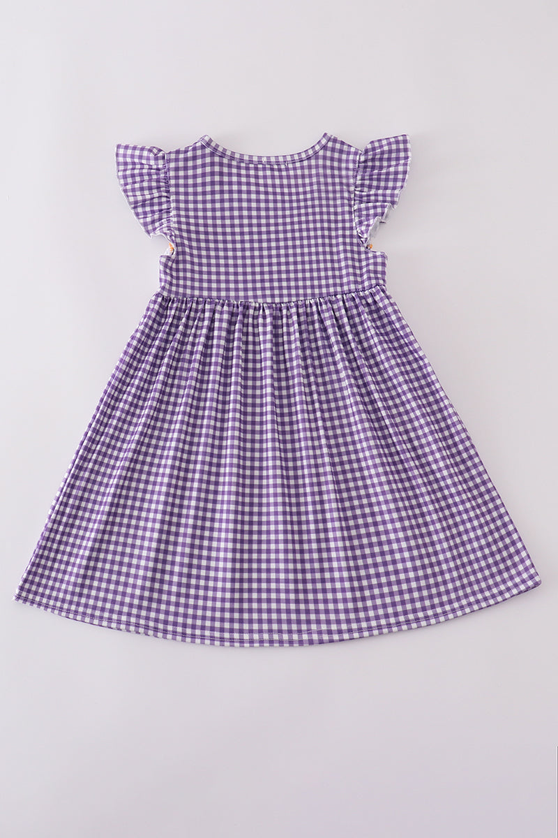 Purple smocked dress with gold LSU geaux embroidery, perfect for game day.