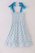 A charming blue floral mom dress with bow tie straps, perfect for spring.